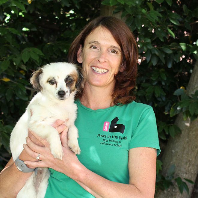 a picture of kiri downes holding a dog